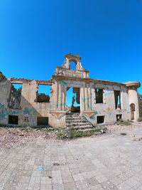 Old building against blue sky