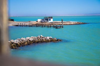 Scenic view of sea against clear blue sky