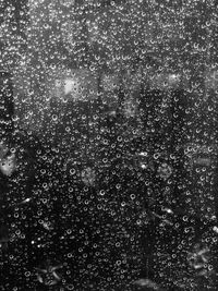 Full frame shot of raindrops on glass