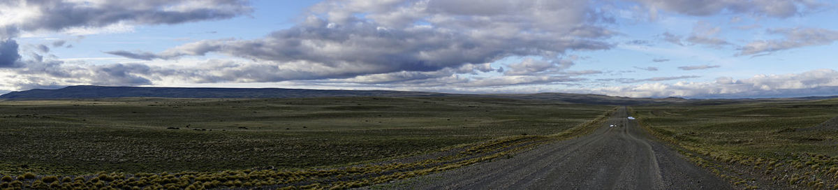 Panoramic view of road amidst land against sky