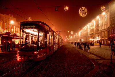 Illuminated city street at night