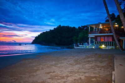 Scenic view of beach against sky at night