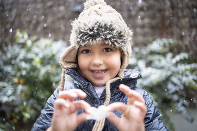 Portrait of smiling boy in snow