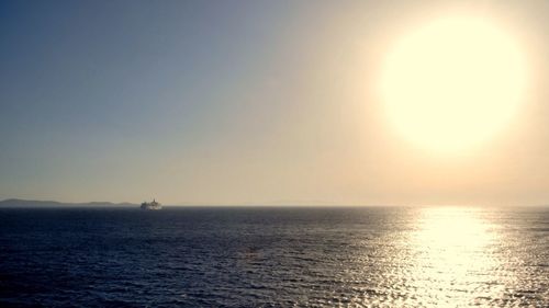 Scenic view of sea against clear sky during sunset