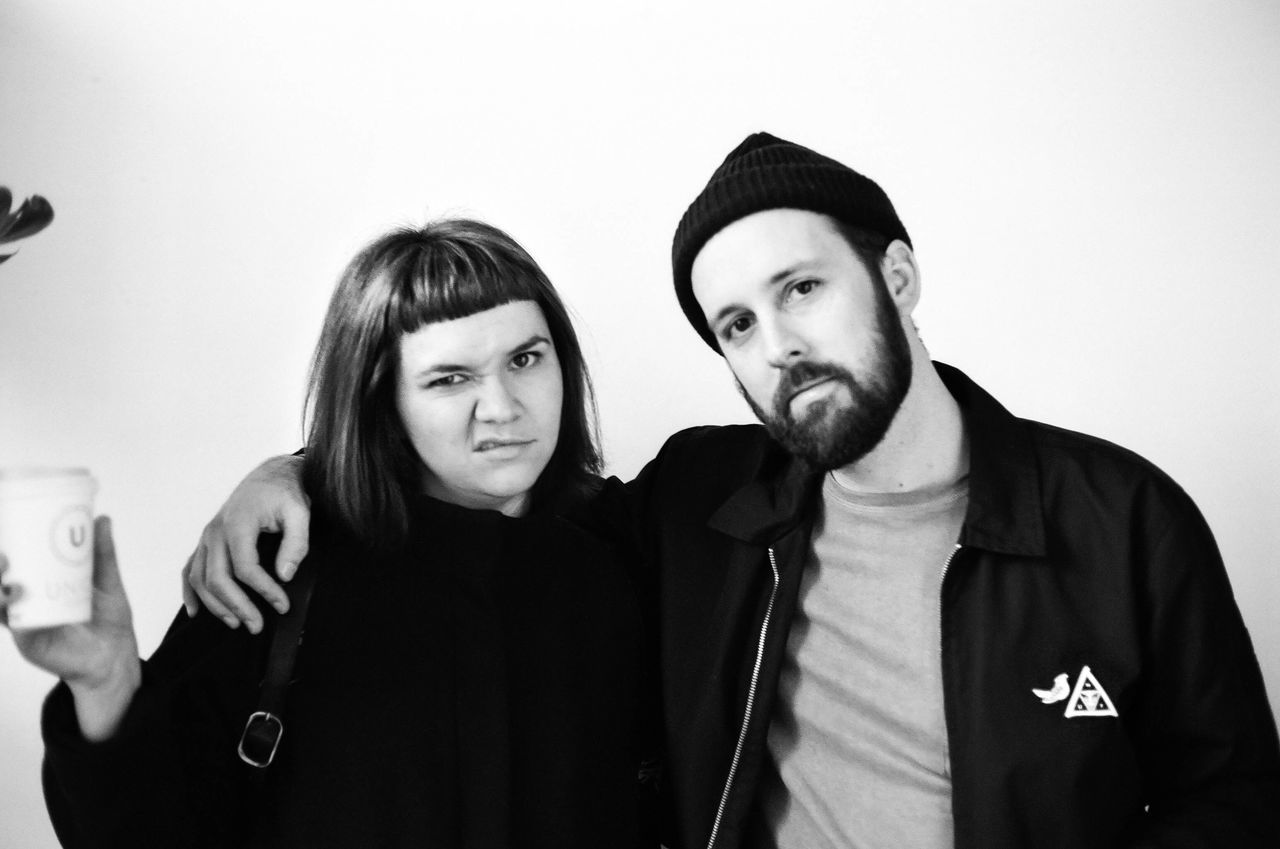 two people, real people, young men, lifestyles, young adult, young women, looking at camera, togetherness, indoors, portrait, day