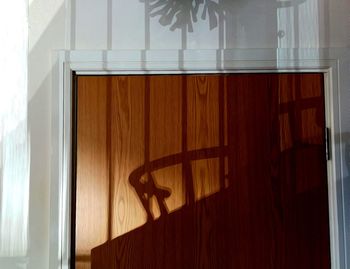 Shadow of window on wooden floor at home