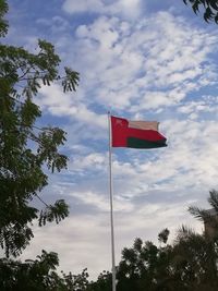 Low angle view of flag against sky