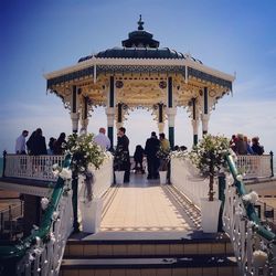 People at wedding ceremony in gazebo