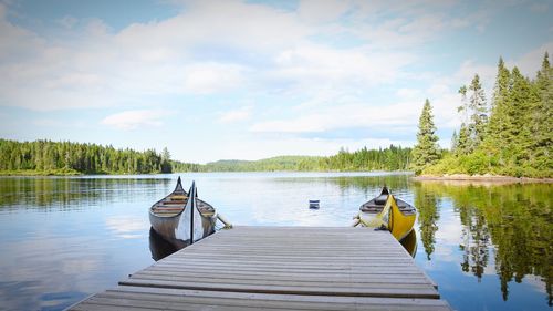 Pier over lake against sky