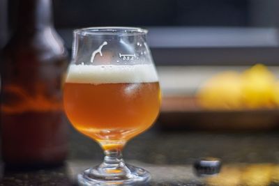 Close-up of beer glass on table
