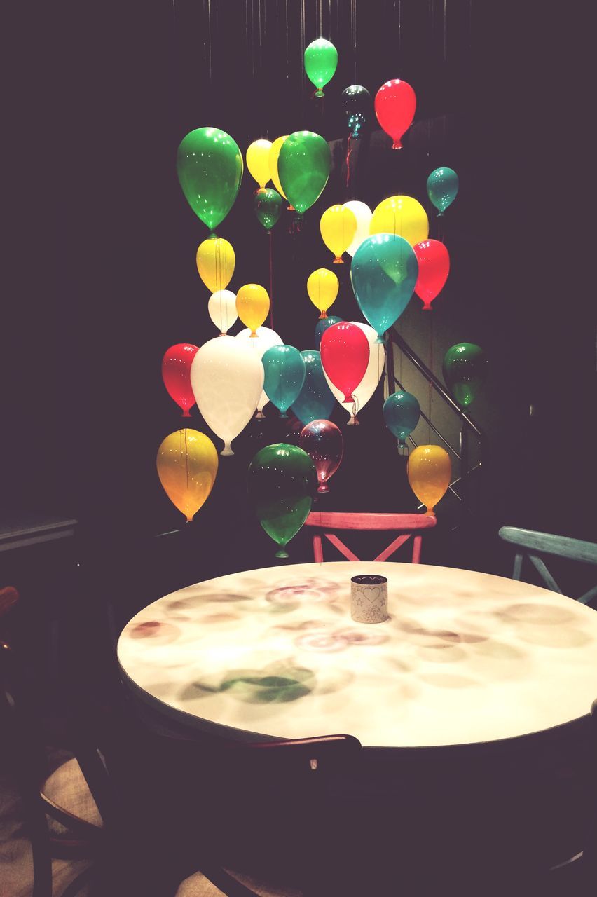 multi colored, indoors, food and drink, still life, table, decoration, colorful, celebration, balloon, freshness, illuminated, no people, food, sweet food, circle, variation, close-up, indulgence, low angle view, sky