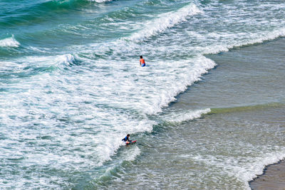 High angle view of people on sea