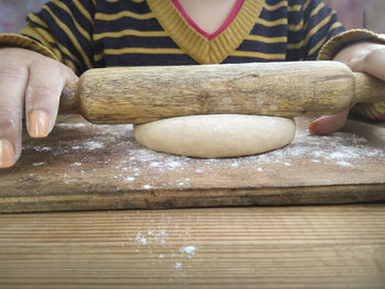 Close-up of person preparing food on table