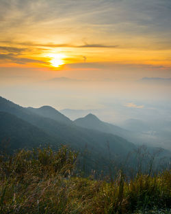 Scenic view of landscape against sky during sunset