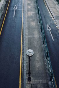 High angle view of arrow symbol on road