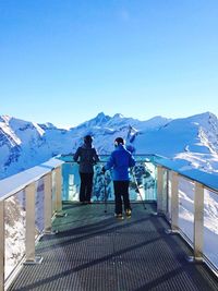 Scenic view of snow covered mountains against sky