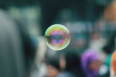 Close-up of bubble flying outdoors