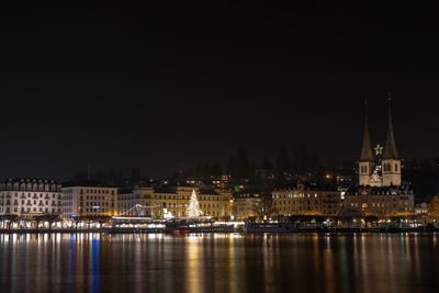 Illuminated buildings in city at night