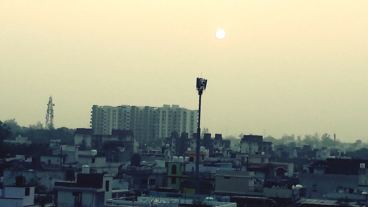 BUILDINGS AGAINST SKY DURING SUNSET