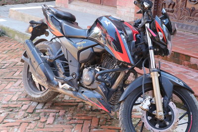 Close-up of bicycles parked on road