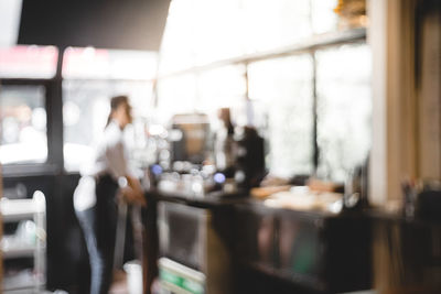 Blurred motion of people working in restaurant