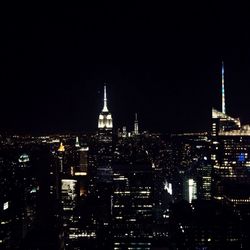 High angle view of city lit up at night