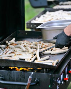 Cropped hand of person preparing food