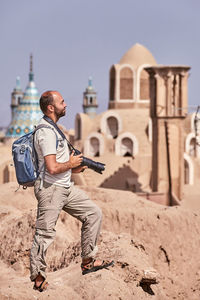 Man with camera at historic place