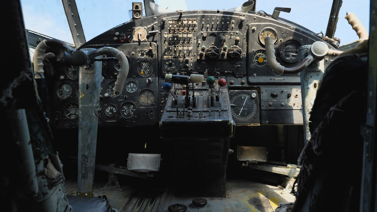 cockpit, mode of transportation, transportation, airplane, aviation, air vehicle, vehicle, control panel, control, aircraft, aircraft engine, vehicle interior, aerospace industry, day, no people, sky, military, dashboard, technology, outdoors