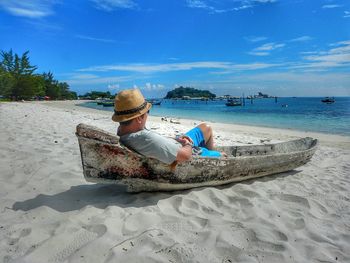 Man on beach against sky