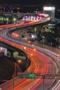 High angle view of light trails on elevated highway at night