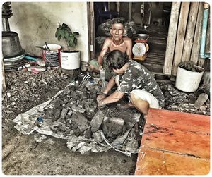 Portrait of a young man sitting outdoors