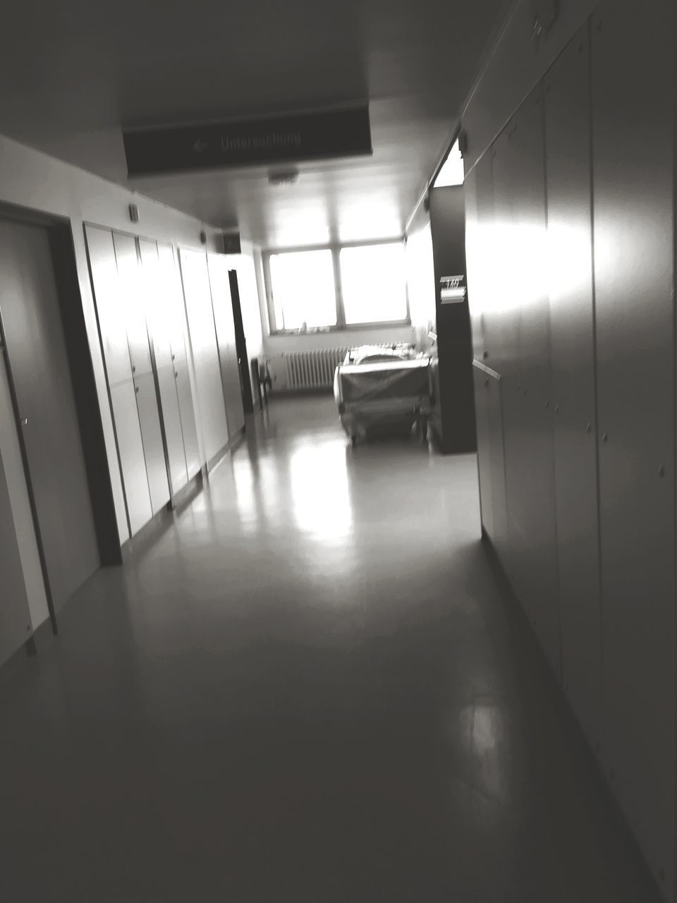 architecture, building, empty, indoors, no people, built structure, corridor, arcade, ceiling, lighting equipment, flooring, illuminated, absence, door, entrance, wall - building feature, the way forward, direction, day, office, light