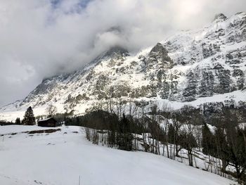 Scenic view of snow covered mountains against sky