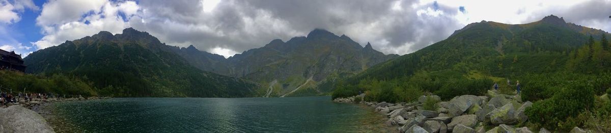 Panoramic view of river amidst mountains against sky