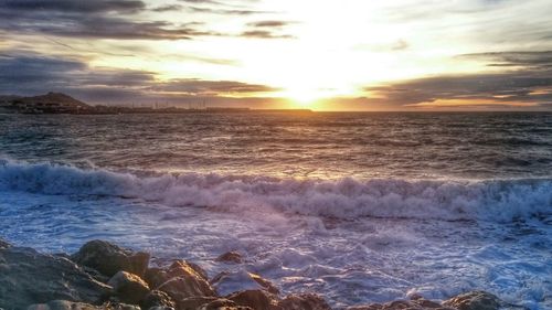 Scenic view of sea at sunset