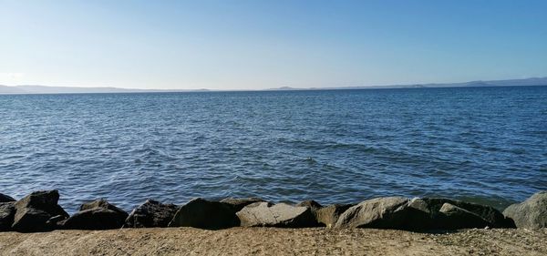 Scenic view of sea against clear sky