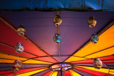 Low angle view of lanterns hanging from ceiling