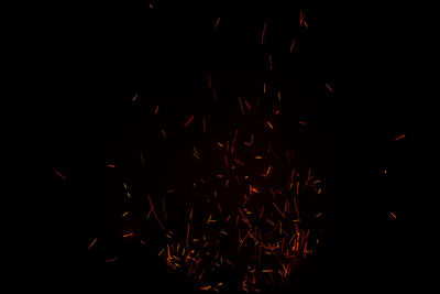 Firework display over black background
