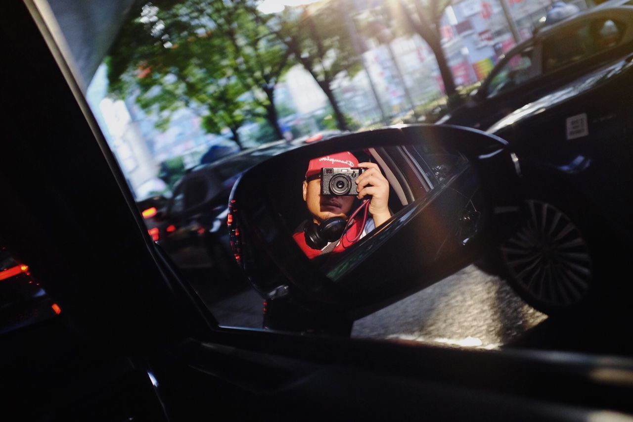 REFLECTION OF CAR IN MIRROR