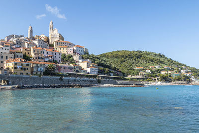 The beach of cervo with his beautiful historic center in background