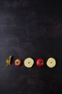 High angle view of apples on table against black background