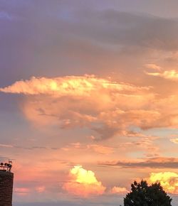 Low angle view of cloudy sky at sunset