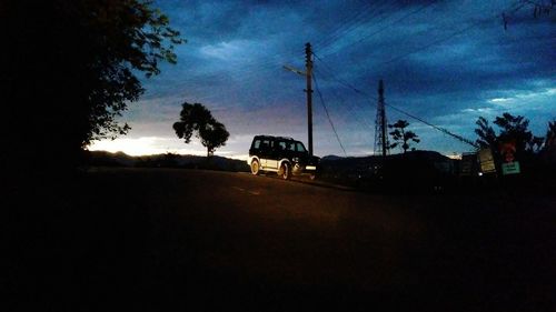 Low angle view of silhouette trees against sky during sunset