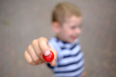 Midsection of boy holding ice cream