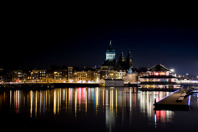 Illuminated buildings in city at night