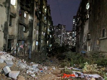 Garbage amidst buildings in city