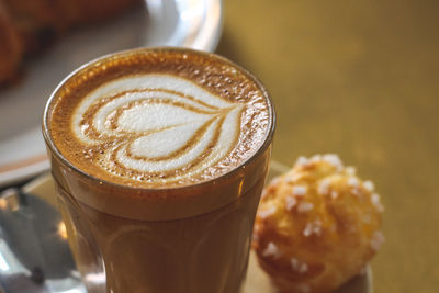 Close-up of cappuccino on table