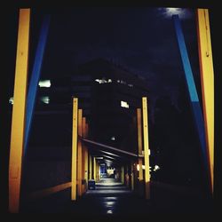 Illuminated bridge at night