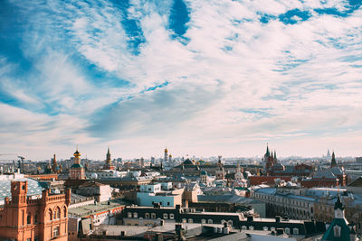 High angle view of city against cloudy sky